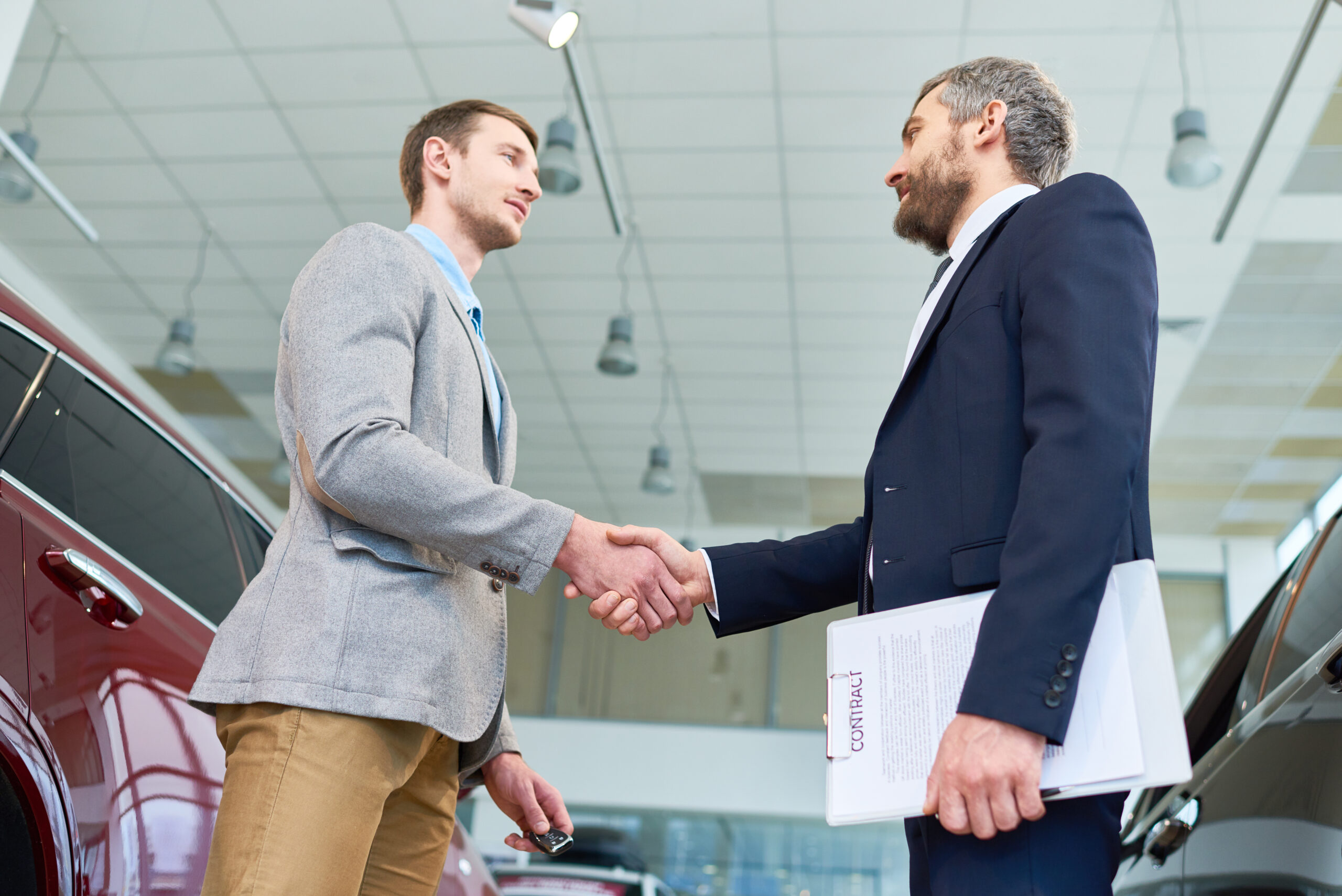 man shaking hands with sales manager